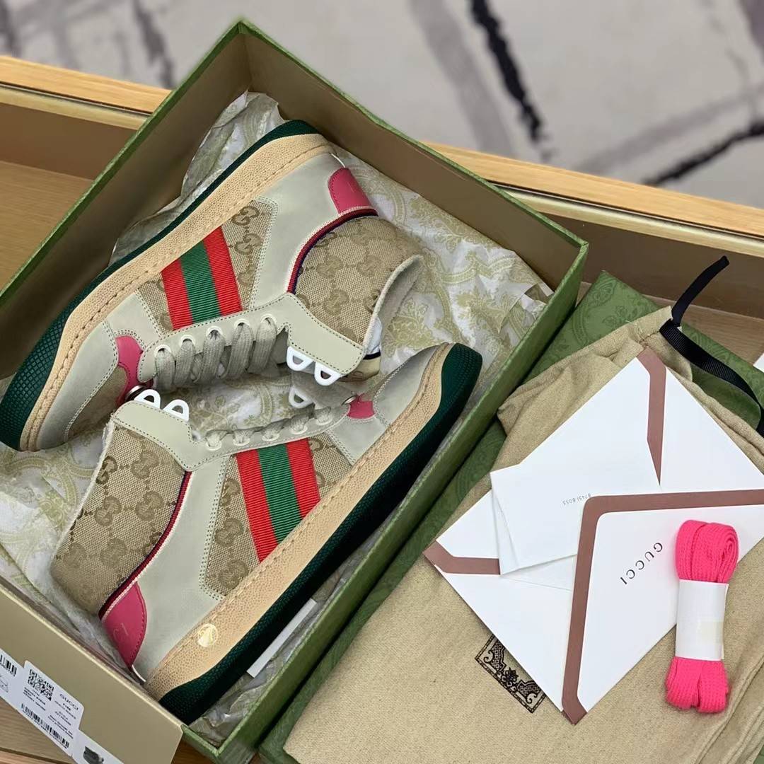 GU*IHigh-top Distressed sneakers